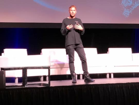 Harrison Hines speaking at a technology conference